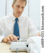 Man using calculator