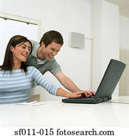 Colleagues using a laptop computer