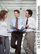 Office workers discussing work