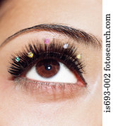 Woman with jewels on her eyelashes