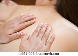 Hands massaging back