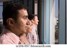 Colleagues looking out of window