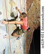 Man on climbing wall