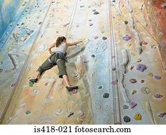 Woman on climbing wall