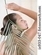 Girl holding a palm leaf