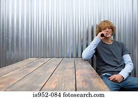 Teenage boy talking on cellular telephone