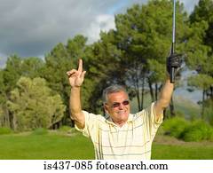 Golf with arms raised