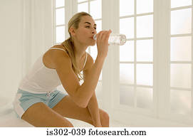 Woman drinking bottle of water