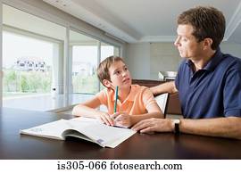 Father helping son with homework