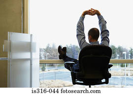 Businessman with feet up