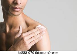 Man using body scrub