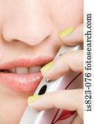 Woman using a cellular telephone