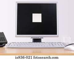 Computer monitor with an adhesive note on it