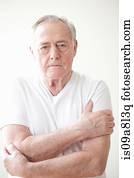 Portrait of senior man wearing white t shirt