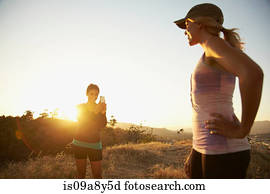 Woman photographing friend