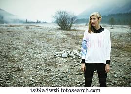 Woman standing in remote setting