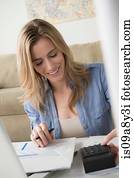 Woman using calculator