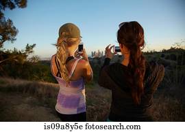 Women photographing scenery