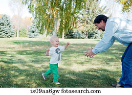 Grandfather playing with grandson in park