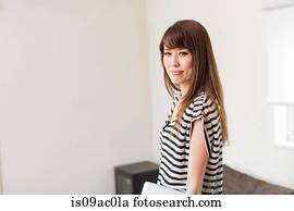 Portrait of woman wearing striped top