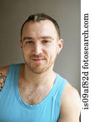 Portrait of man wearing turquoise vest