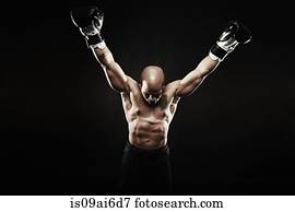 Boxer with arms raised