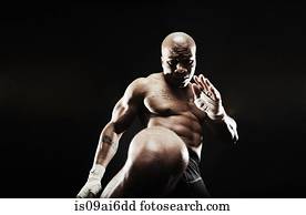 Mid adult man kickboxing