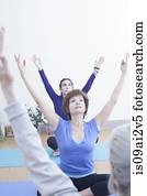 Women practising yoga