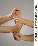 People putting fists together