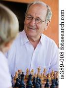 Grandfather and grandson playing chess