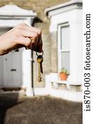 Person with keys to house