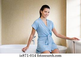 Woman sat on bath