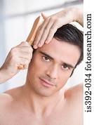 Man combing his hair