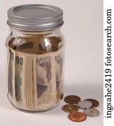 Money with jar 