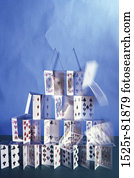 Close-up of a house of collapsing playing cards