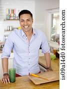 Mid adult man in kitchen, portrait