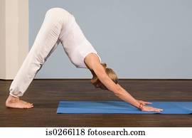 A mature woman in a yoga position