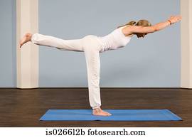 A mature woman in a yoga position