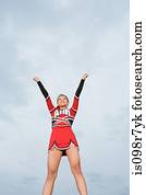 Cheerleader with arms raised