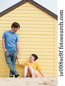 Couple by a beach hut