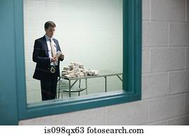 Detective looking at money