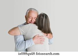 Senior couple hugging