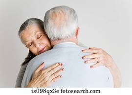 Senior couple hugging