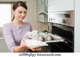 Woman cooking fish