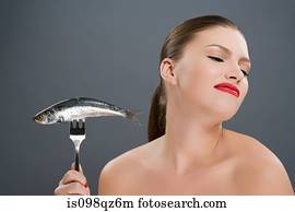 Woman disgusted at a fish