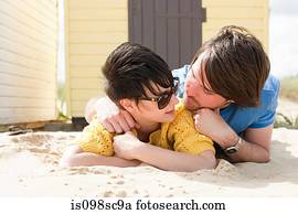 Young couple by a beach hut