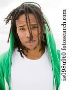 Young man with green hooded top, portrait