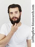 Portrait of bearded man in white t-shirt