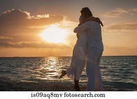 "Senior couple hugging on beach, Maldives"
