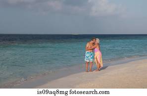 "Senior couple hugging on beach, Maldives"